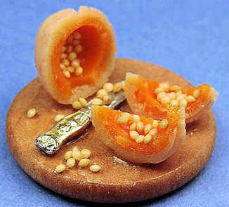 Slicing canteloupe on board (image for) Slicing canteloupe on board