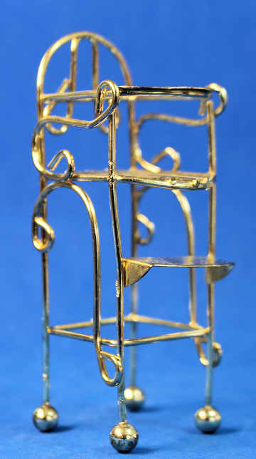 (image for) Brass high chair - a couple of scratches on the tray area