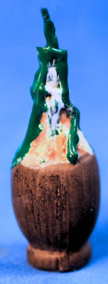 (image for) Melted candle in wine bottle